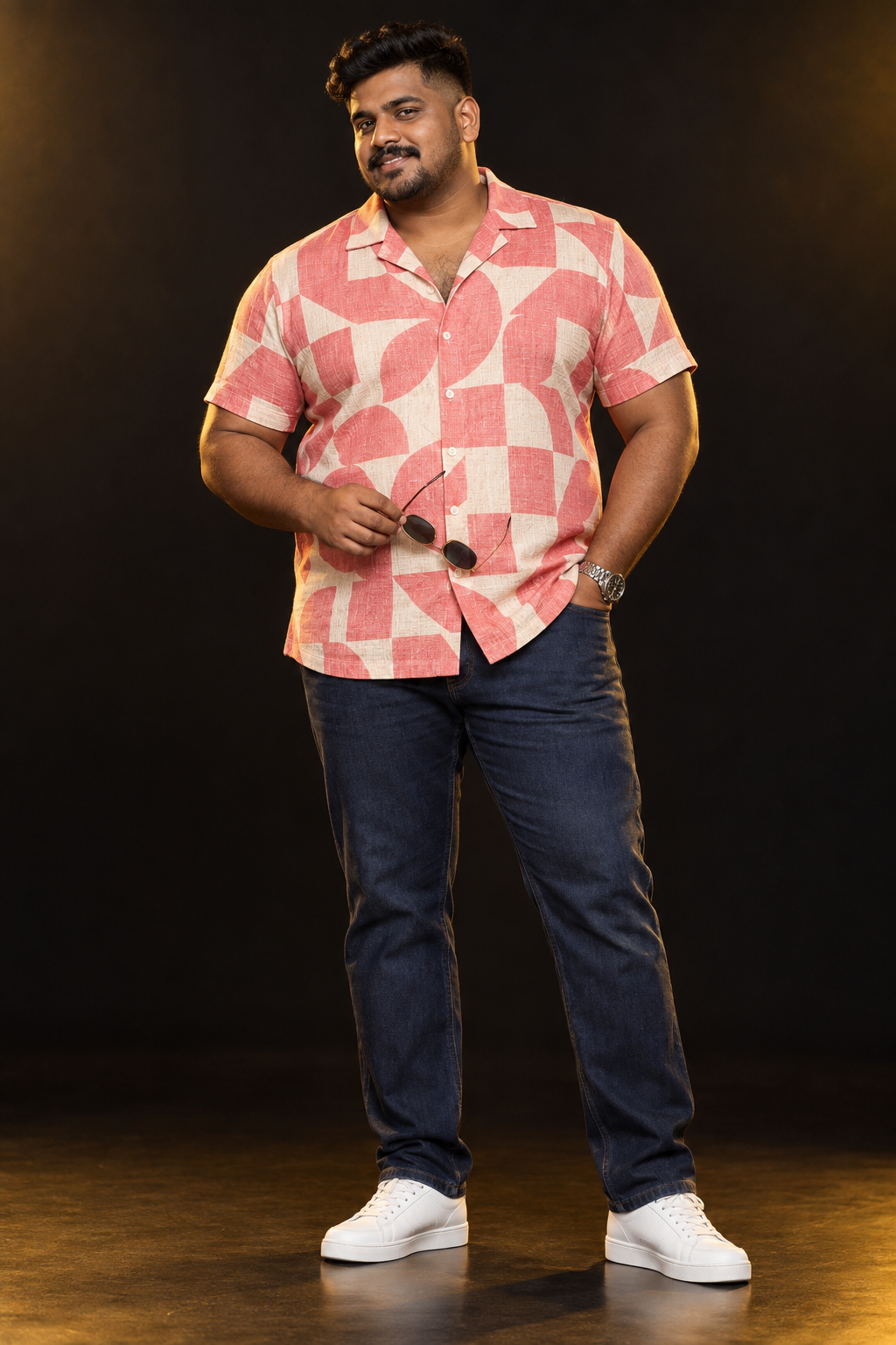Plus-size male model wearing a coral geometric resort shirt